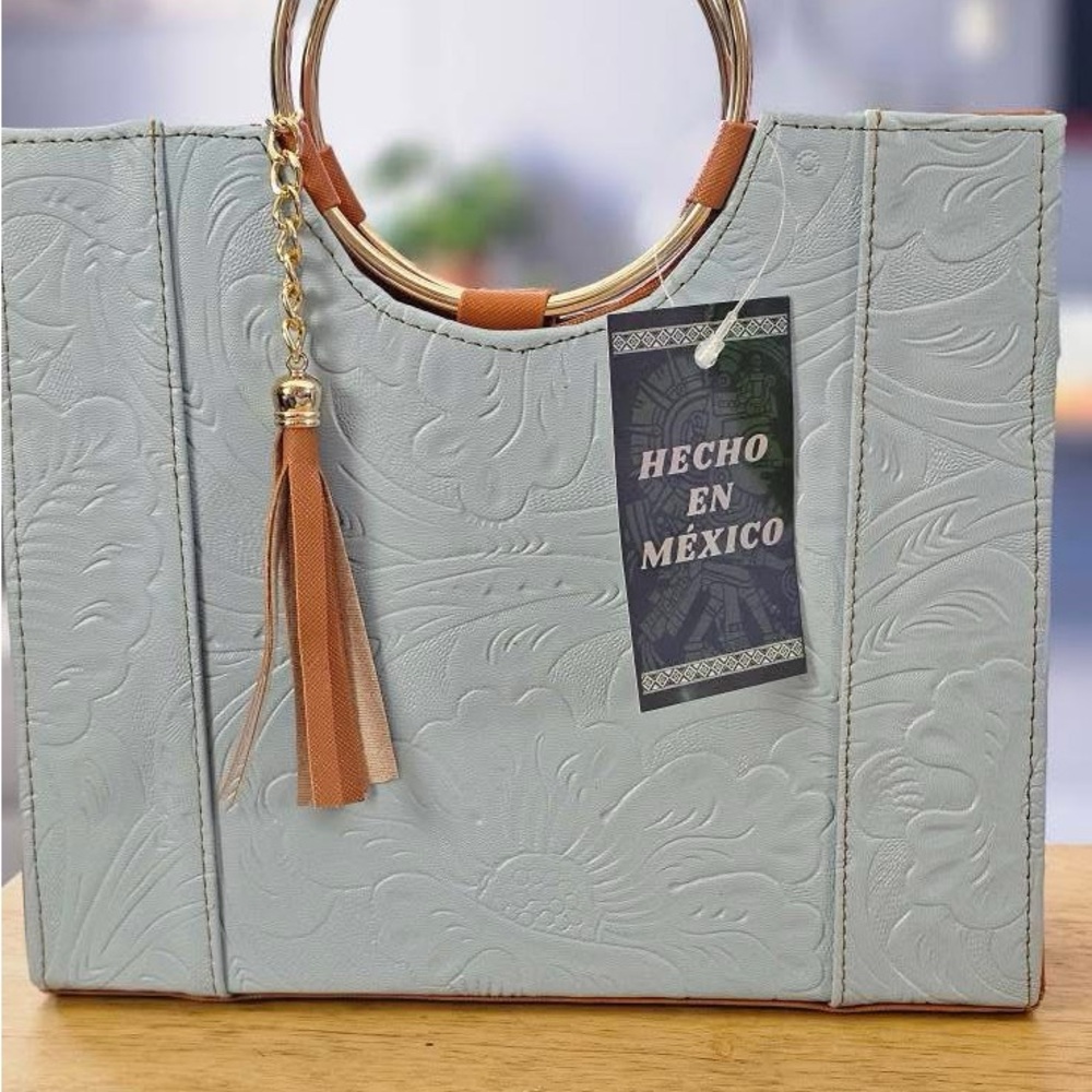 Elegant Blue Embossed Handbag with Gold Accents